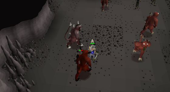 Surrounded by lesser demons in the Slayer Cave