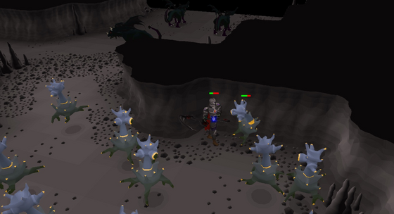 Fighting smoke devils in the Divine Slayer Cave, Wilderness level 38, below the dark beasts' ledge