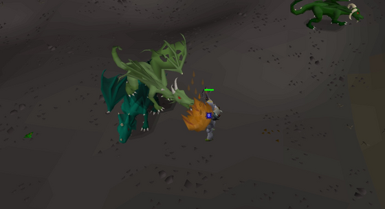 A green dragon breathing fire at the player in level 23 Wilderness