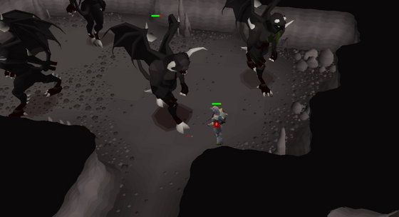 Ranging black demons on a ledge in the Divine Slayer Cave