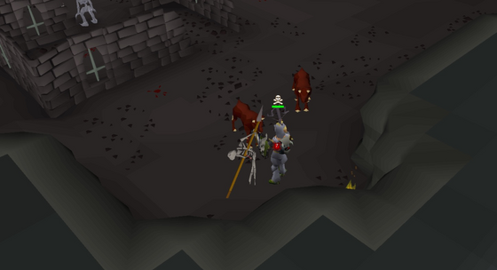 Hellhounds and a skeleton attacking the player in the Donator Zone dungeon