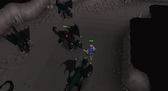Holding off a pack of black dragons with a Dragonfire ward in the Divine Slayer Cave