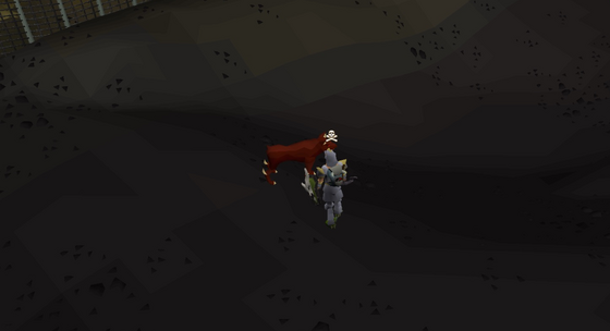 A hellhound leaping at the player in level 49 Wilderness